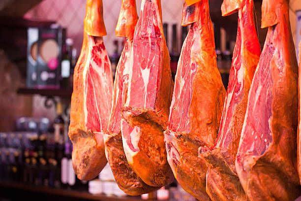Traditional Spanish Serrano Schinken sliced and served with cheese and wine